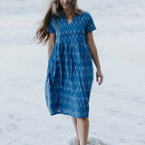 Close-up of a blue Ikat cotton dress with a gathered waist, ethically crafted for timeless, eco-friendly fashion