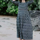 Woman wearing the Melbourne Box Dress in black and white Ikat cotton, standing outdoors.