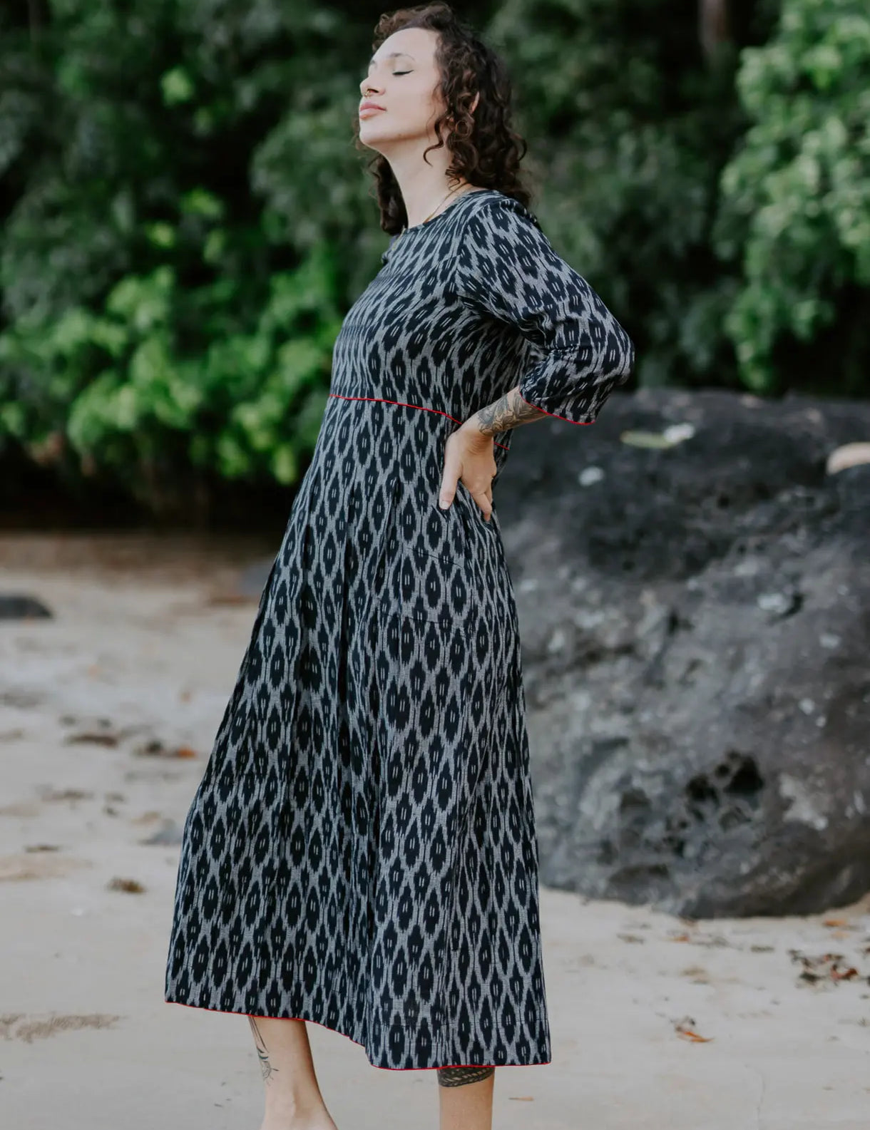 Handwoven black and white Ikat cotton dress with red piping details