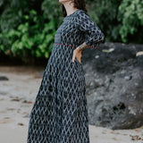 Handwoven black and white Ikat cotton dress with red piping details